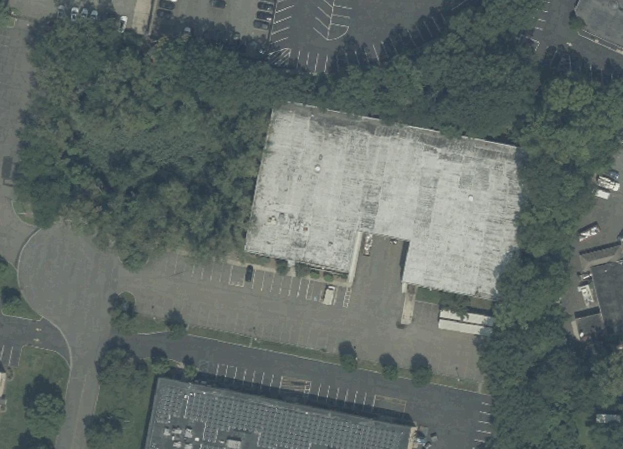 2023 USDA NAIP overhead of 29 Park Way, showing the full subject building roof and parking/access context; historical aerial, listing extent unverified.